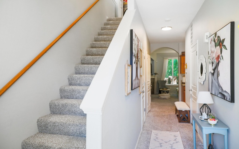 Stairs to second level and hallway to main level